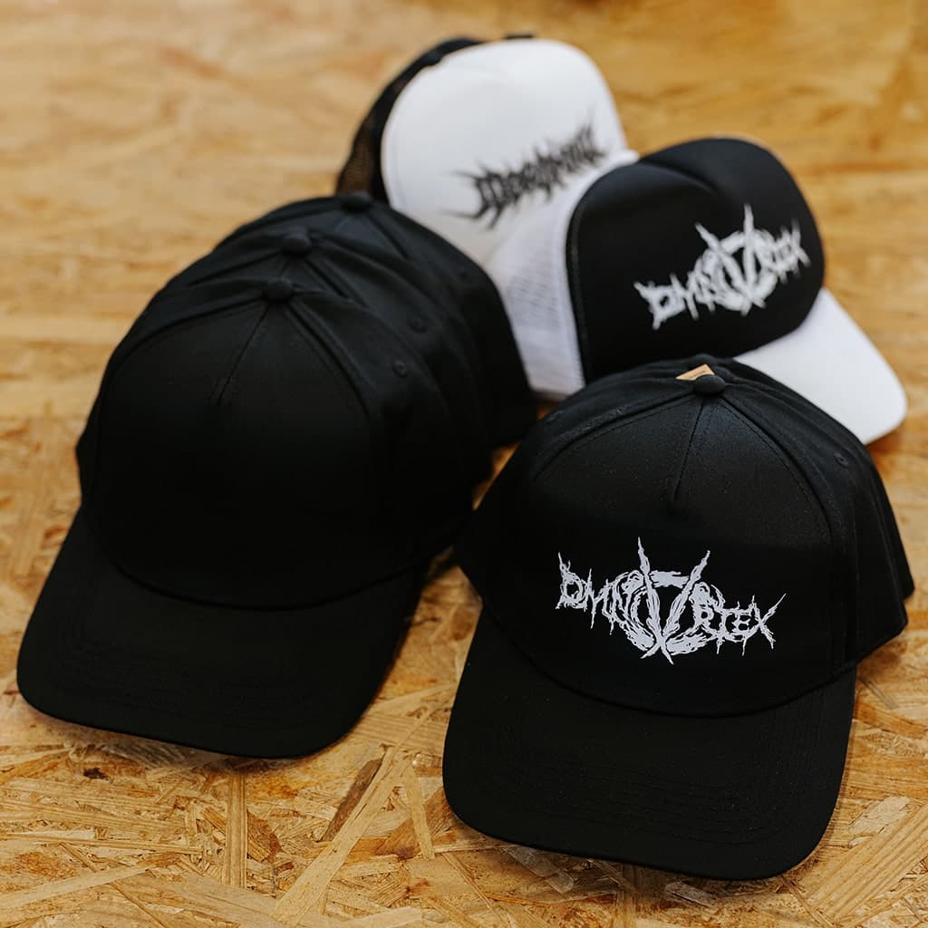 Custom embroidered metal band logo baseball caps with white thread on black fabric