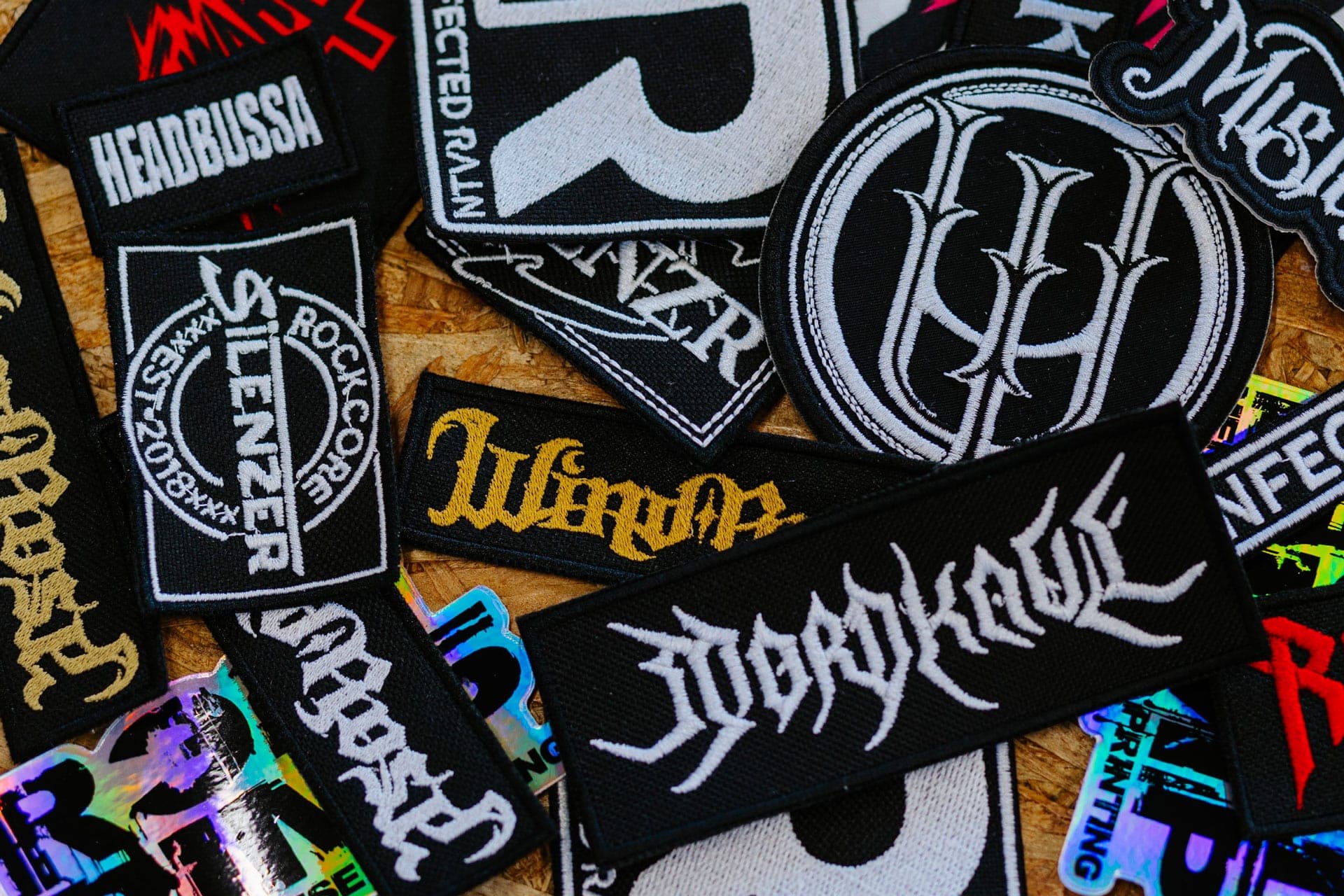 Embroidered metal band patch collection featuring SLAYER and various European bands