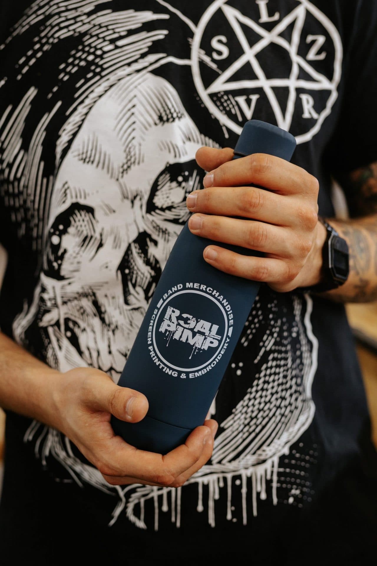 Real Pimp branded insulated can cooler with embroidered logo for band merchandise