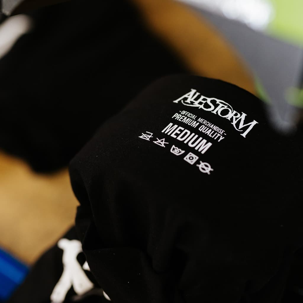 Custom printed neck label on Alestorm band t-shirt showing premium quality branding