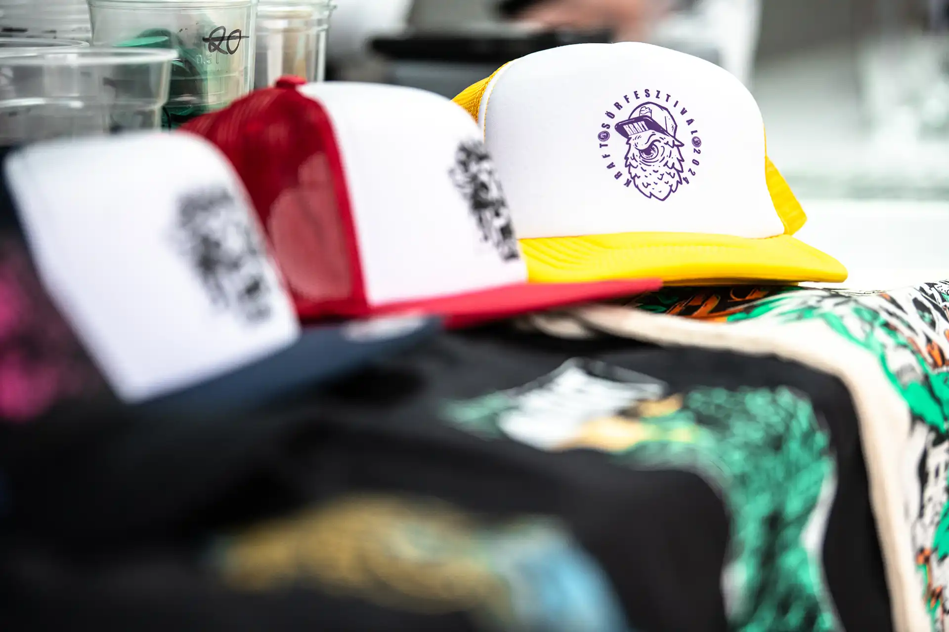 Custom printed trucker caps with festival branding for music event merchandise