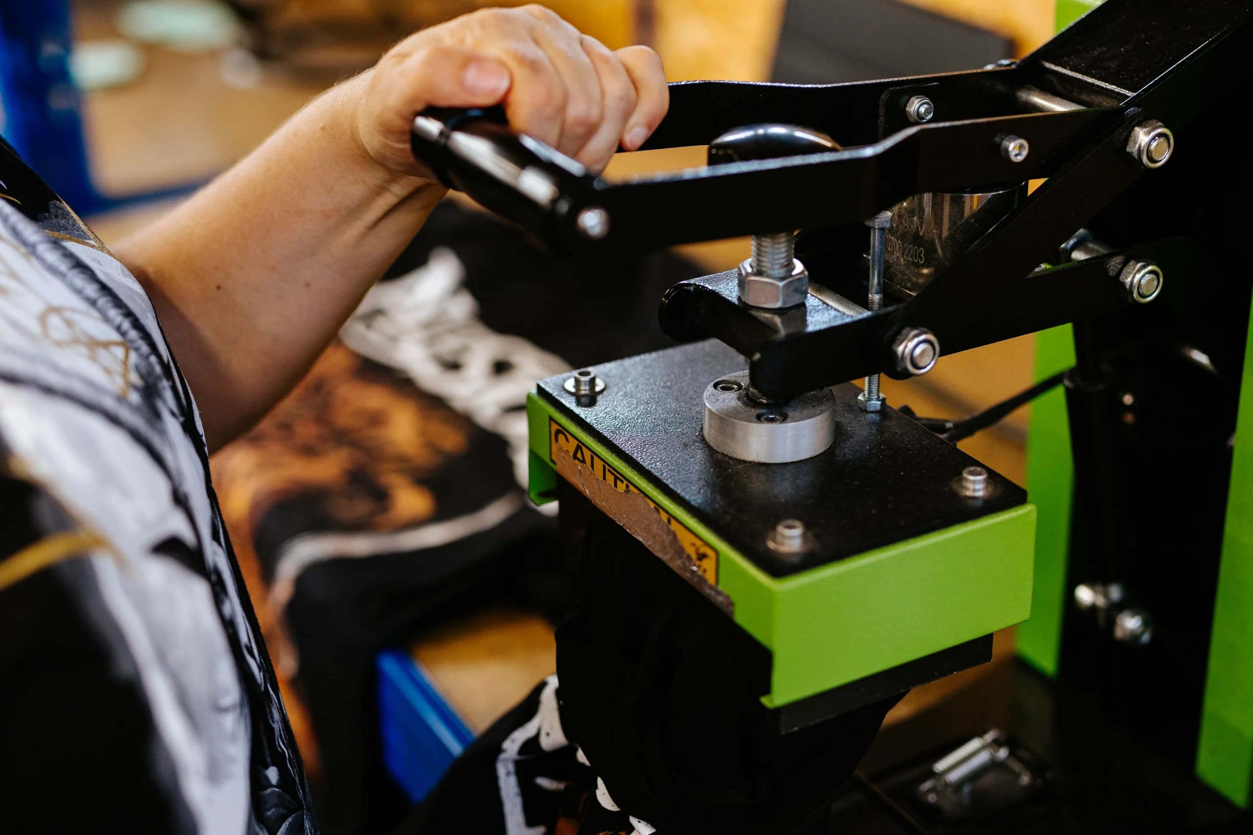 Industrial heat press machine applying custom labels at precise temperature for quality results