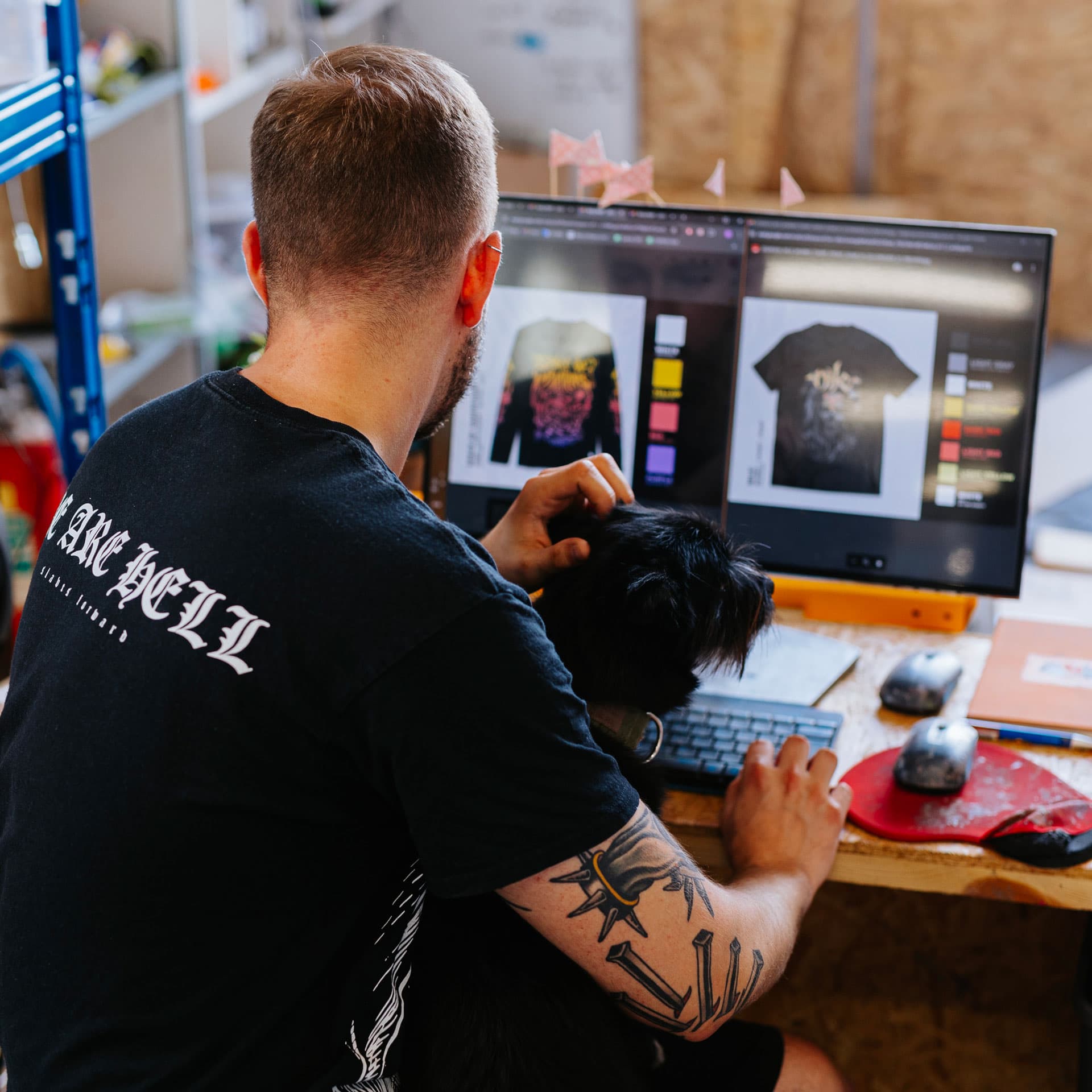 Designer creating custom band merchandise mockups for screen printing production